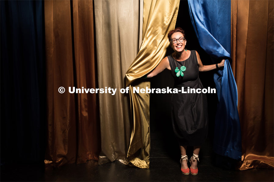 Megan Elliott is the founding director of the Johnny Carson Center for Emerging Media Arts. She is photographed with the curtain Johnny Carson used for his television show. July 1, 2017. Photo by Wyn Wiley. Not for use outside of UNL marketing. 